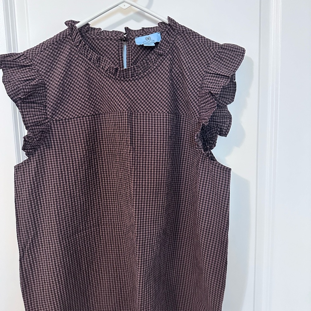 CeCe, large brown and black checked blouse.